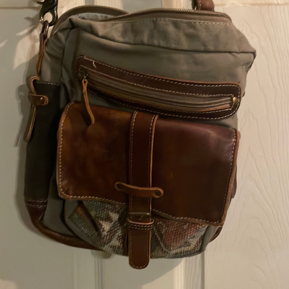 Army green color Myra bag with leather accents and Aztec type print